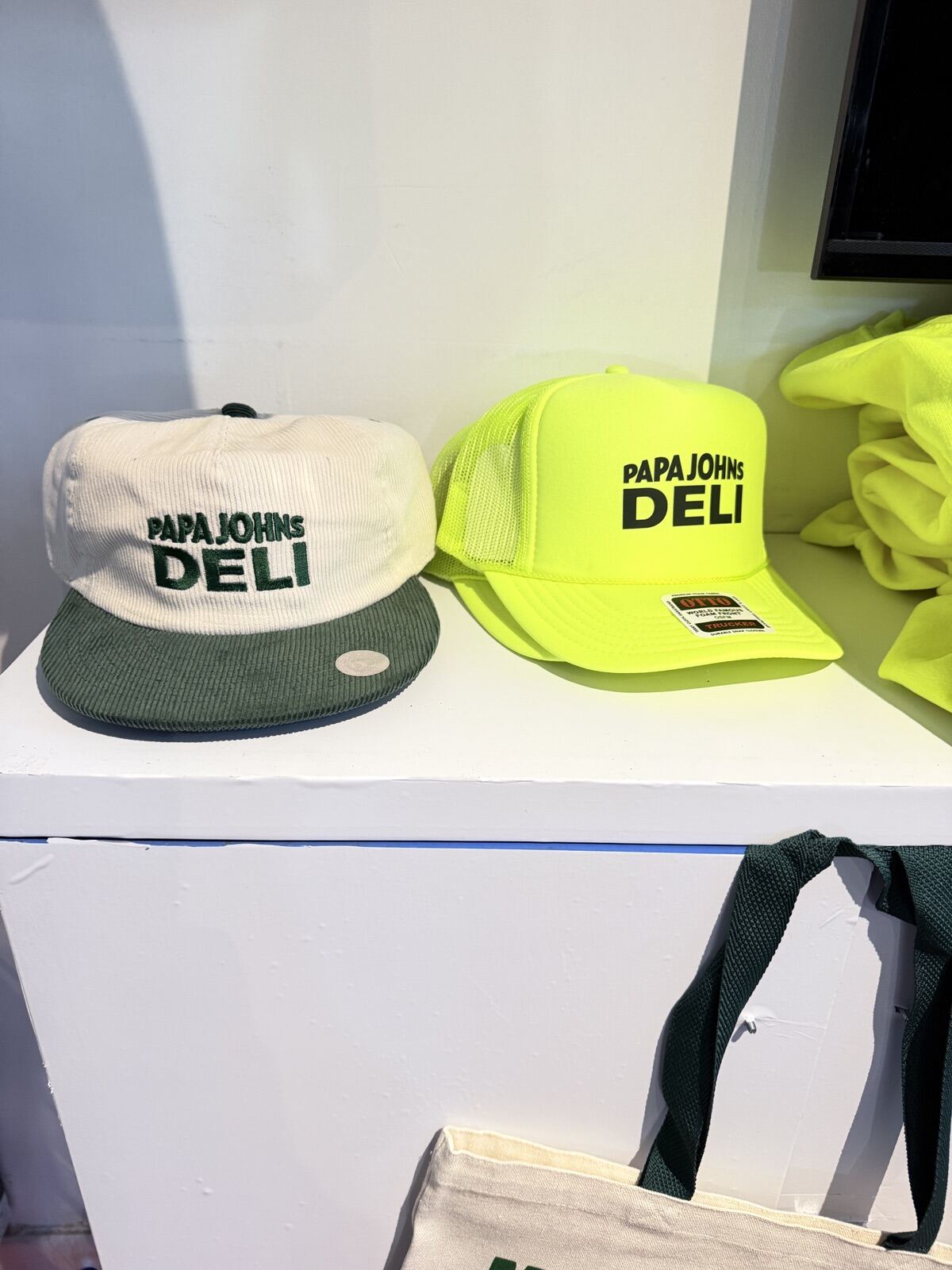 Merch display table with hats and shirts arranged for guests